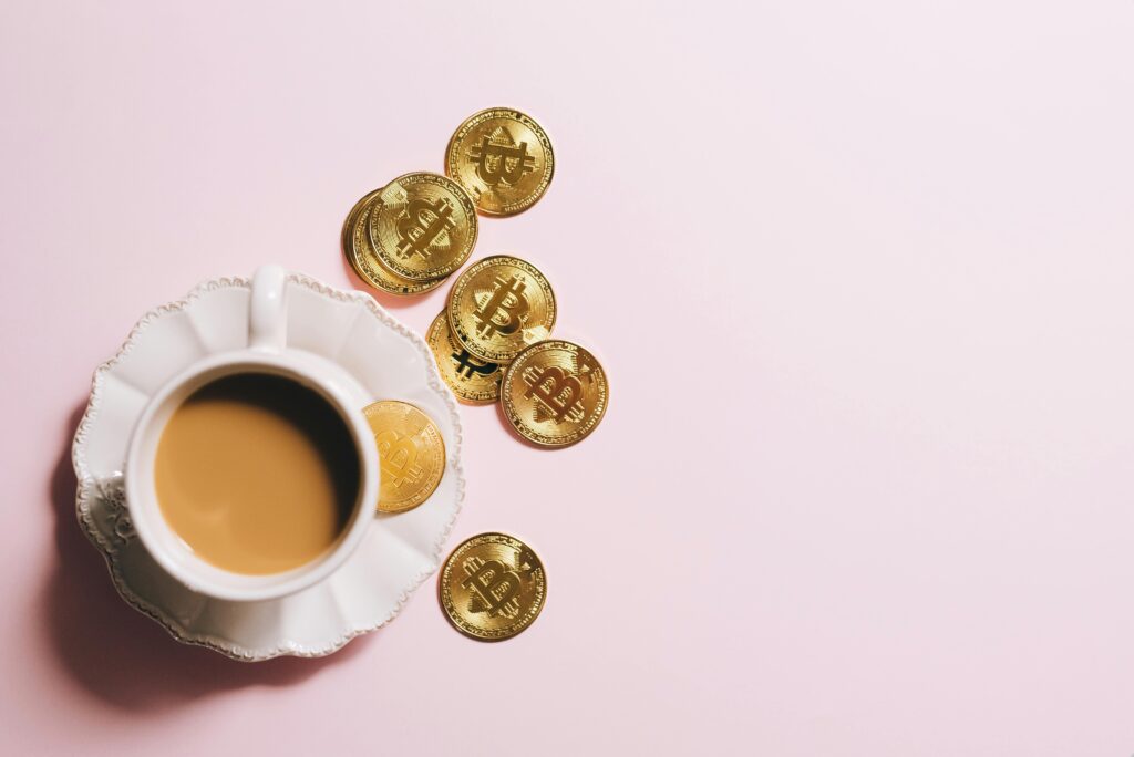 a cup of coffee and gold coins